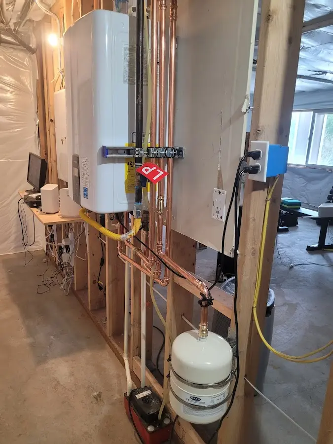 Licensed plumber repairing a kitchen sink in Olyphant