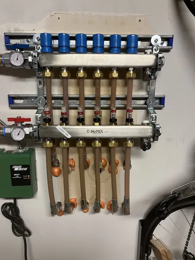 Plumber performing Water Heater Repair at a residential property in Olyphant